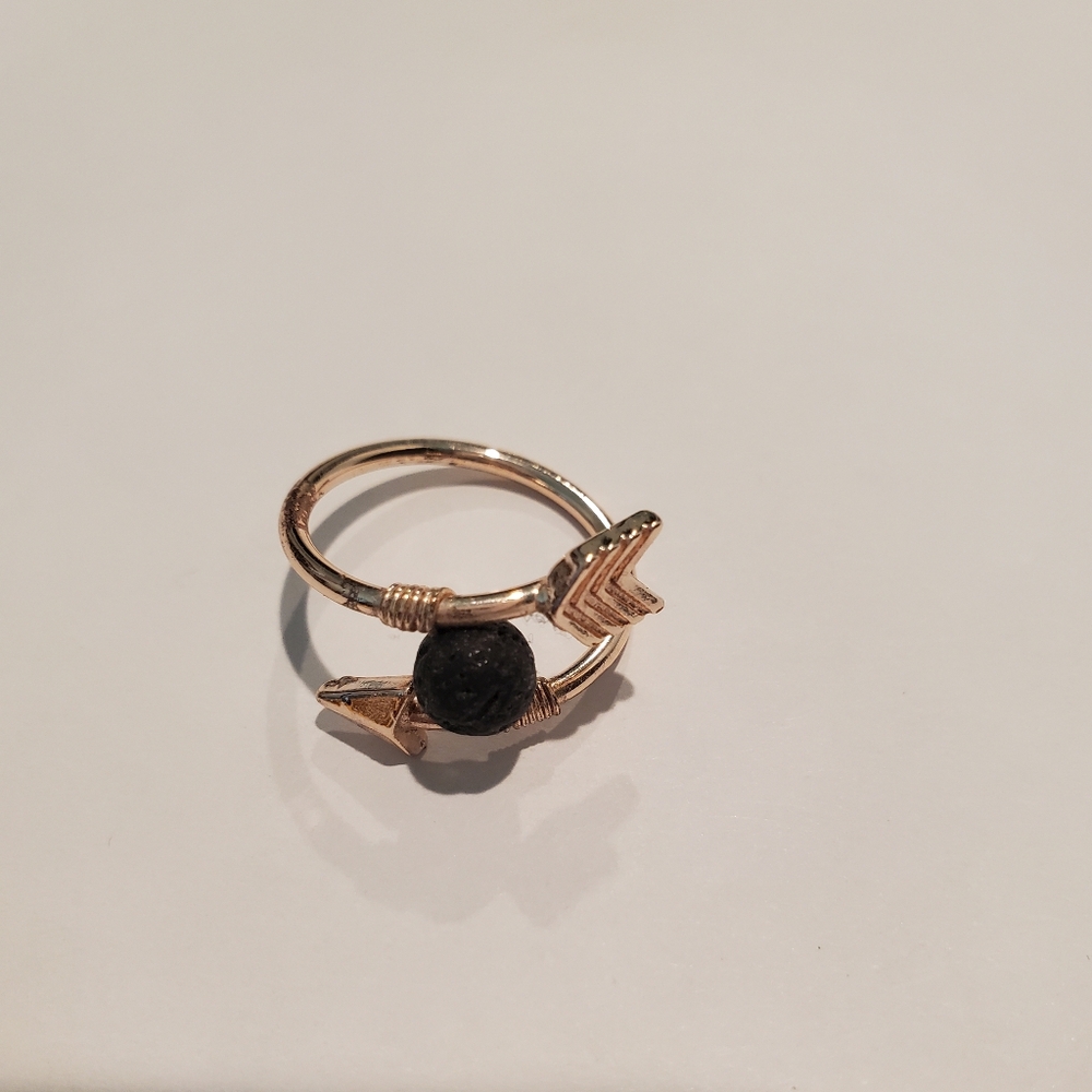 Elegant Gold Arrow Ring with Black Stone